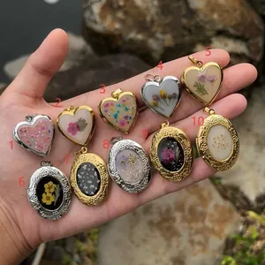 Vintage heart and oval locket pendants with dried flowers in gold and silver frames