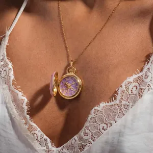 Vintage style gold openable locket necklace with a purple clock face and gear details.