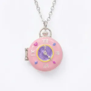 Pink pocket watch locket necklace with Roman numerals and heart accents on white background