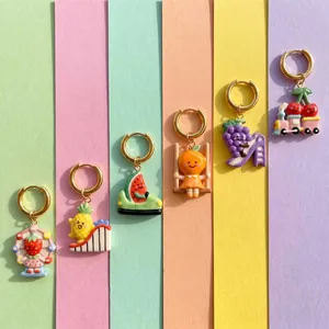 Detail of six colorful cartoon fruit pendants on matching colored background strips
