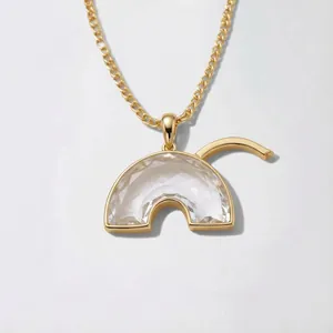 Vintage rainbow-shaped pendant necklace with transparent faceted glass and gold finish
