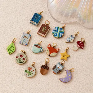 Collection of various 18K gold-plated stainless steel enamel charms for DIY jewelry