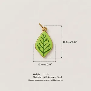 Detailed macro view of green enamel leaf pendant in 316 stainless steel with specs