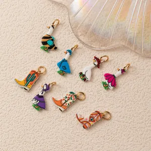 Detailed view of cute colorful enamel goose and cowboy boot charms for DIY jewelry