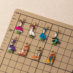 Macro view of assorted colorful cartoon goose and boot enamel charms for DIY jewelry