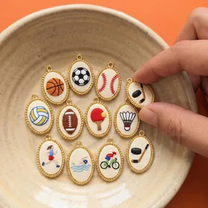Macro view of various sports-themed handmade embroidery pendants in gold frames