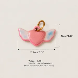 Detailed macro view of pink winged heart pendant with dimensions and product specs