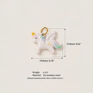 Detailed view of white enamel unicorn pendant with size markings in mm and inches