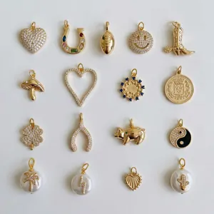 Collection of various gold and crystal lucky charms for shoelace decoration details