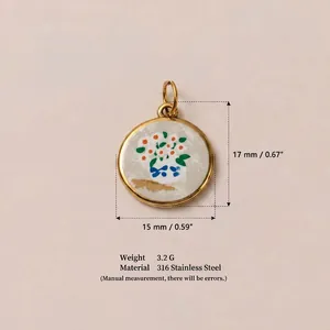 Detailed macro view of round stainless steel flower pendant with 18K gold plating