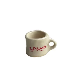 Miniature cup-shaped pendant with red 'Habibi' Arabic script, ceramic finish charm