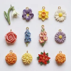 Collection of 12 colorful ceramic floral and plant pendants for DIY jewelry design