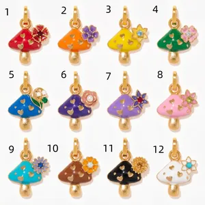 Twelve vibrant enamel mushroom charms with floral accents for customized DIY jewelry