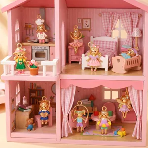 Collection of colorful cartoon doll charms displayed in a miniature pink dollhouse