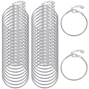 Close-up of multiple 2.6mm silver snake chain bracelets with heart charms for DIY