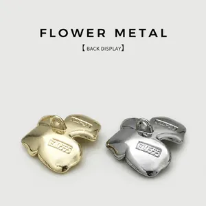 Back view of irregular flower-shaped metal buttons in gold and silver finish.