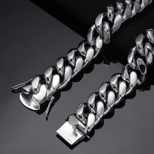 High-detail macro shot of a silver stainless steel Cuban link chain necklace with clasp