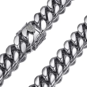 Close-up macro detail of a shiny silver stainless steel Cuban link hip-hop necklace