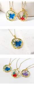 Detail view of elegant gold-framed resin pendants with preserved colorful real flowers