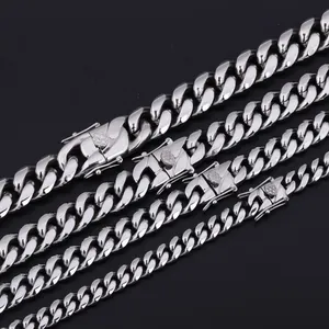 Close-up of polished stainless steel Cuban link chains in four varying widths