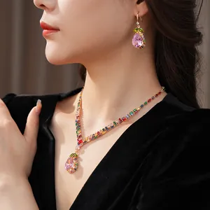 Close-up of luxury colorful rhinestone jewelry set with water drop pendant on a model