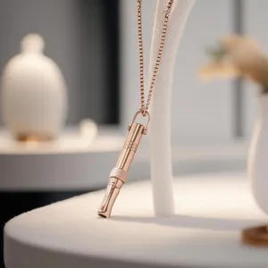 Close-up macro view of a rose gold titanium steel breathing necklace for stress relief