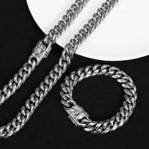 Detailed macro view of a heavy hip hop stainless steel Cuban link necklace and bracelet set
