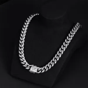 Heavy duty stainless steel Cuban link necklace for men and women on black display stand.