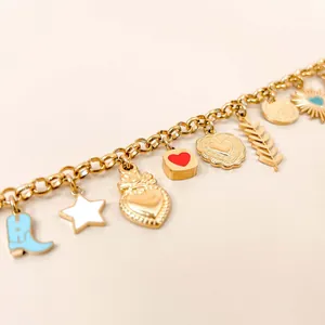 Close-up of the 18K gold plated charm necklace featuring heart and star shaped pendants