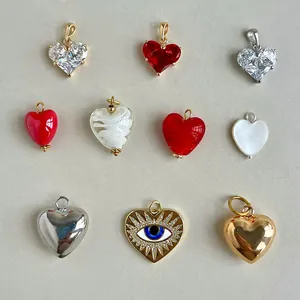 Collection of heart-shaped DIY pendants including evil eye, zircon, and glass designs