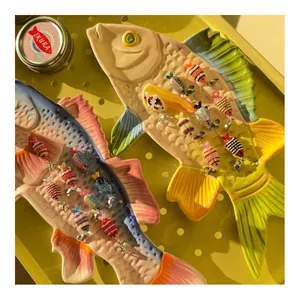 Colorful beaded fish pendants with lobster clasps for ocean-themed DIY jewelry