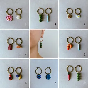 Collection of colorful dopamine hoop earrings with food and nature charms and model view