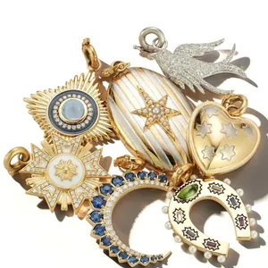 Macro view of colorful stainless steel horseshoe and star charms with crystals