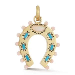 Detailed view of gold horseshoe pendant featuring turquoise stones and pink bead accents.