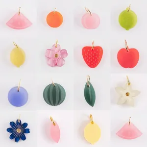 Detailed showcase of colorful frosted fruit and flower charms for DIY jewelry making projects