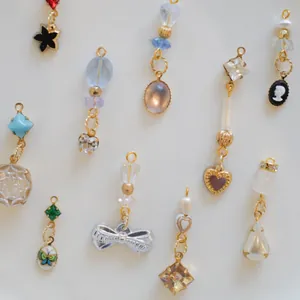 Assorted vintage style jewelry pendants with bow heart butterfly and gemstone details