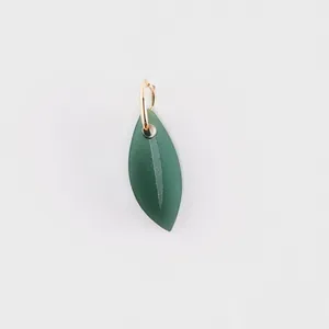 Detailed macro view of a green matte leaf pendant with a gold stainless steel ring connector.