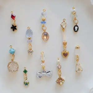 Assorted fashion pendants featuring heart, bow, and gemstone designs for DIY jewelry making.