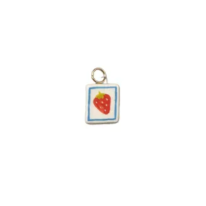 Cute strawberry fruit pendant with gold ring on white background for DIY jewelry making