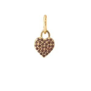 Close-up of vintage heart pendant with red stones and 18K gold finish