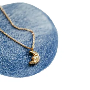 Elegant 18K gold plated stainless steel crescent moon pendant necklace for women.