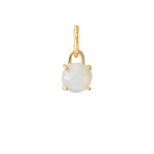 Detailed macro view of a round faceted white opal pendant in a gold plated setting