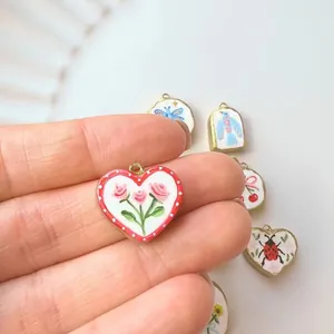 Hand-painted heart and animal motif charms in stainless steel frames for DIY jewelry making