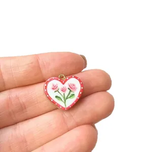 Handmade heart-shaped pendant with pink rose floral painting on white enamel base finish