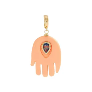Bohemian peach Hamsa hand pendant with teardrop blue stone inlay and gold clasp jewelry