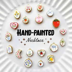 Detailed view of hand-painted stainless steel pendants with floral and fruit motifs
