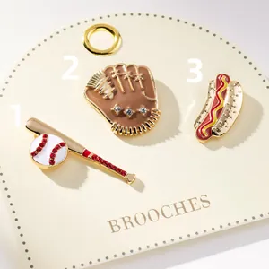 Detail view of sports themed brooch set with baseball, glove and hot dog designs.