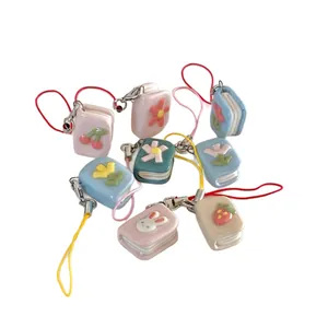 Cute set of mini book charms with colorful enamel flower bunny and cherry patterns for DIY
