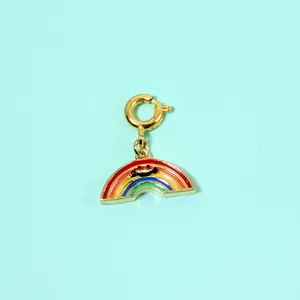 Close-up of a colorful enamel rainbow pendant with a cute smiley face design.