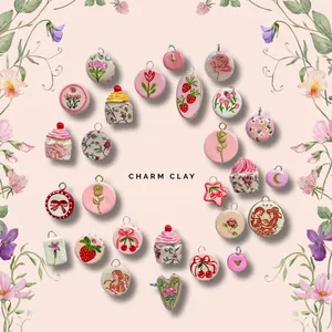 Detailed view of various handmade clay pendants with floral, cherry, and bow patterns